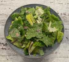 A salad with sardines and onions