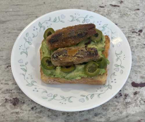 Avocado toast with sardines and olives