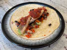 Tacos with mackerel, avocado, pepper, onion, black bean and salsa